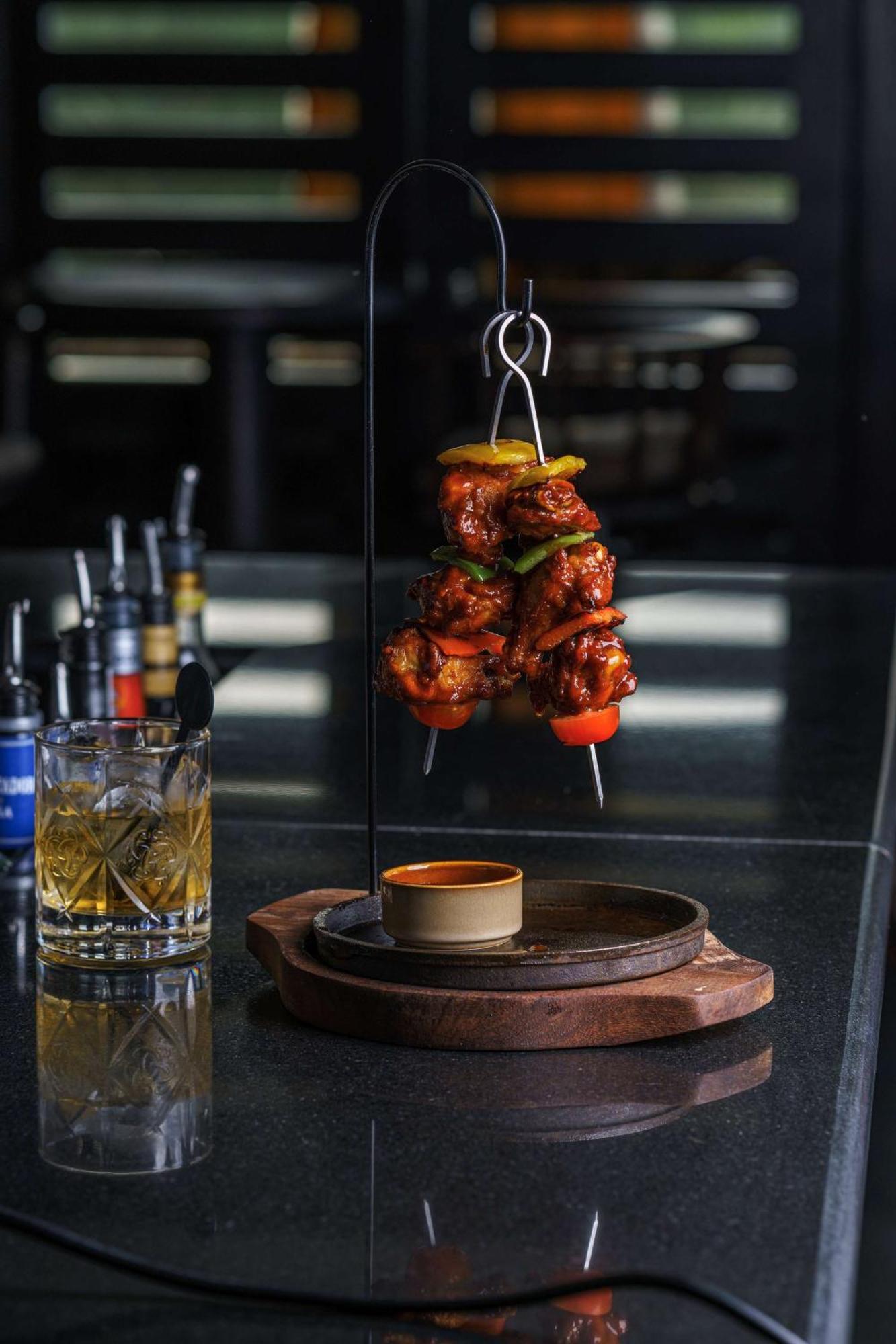 Radisson Blu Hotel & Resort, Sohar Exterior photo A chicken tikka served on a skewer